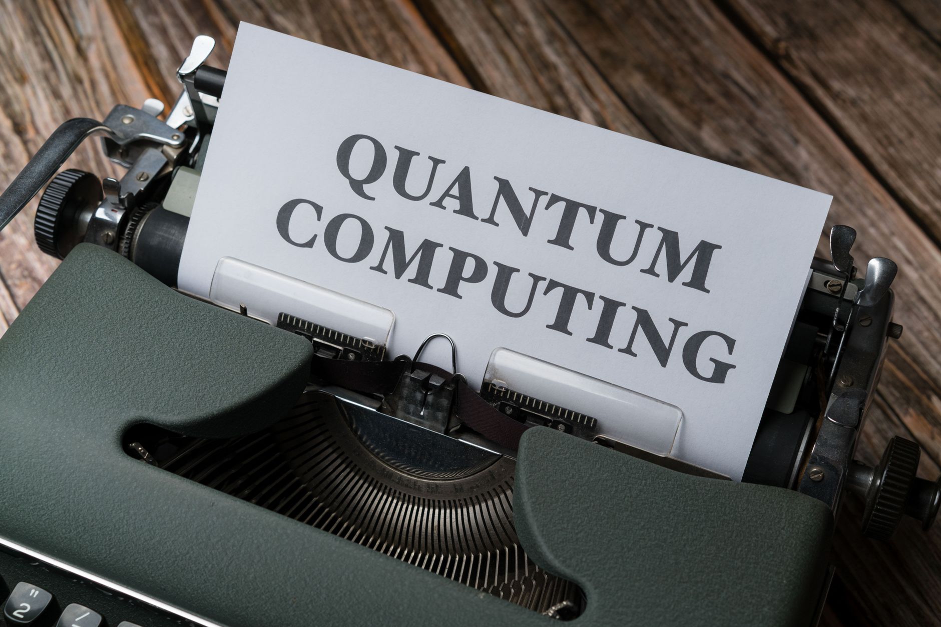 Researchers examining quantum computing hardware in a university laboratory setting